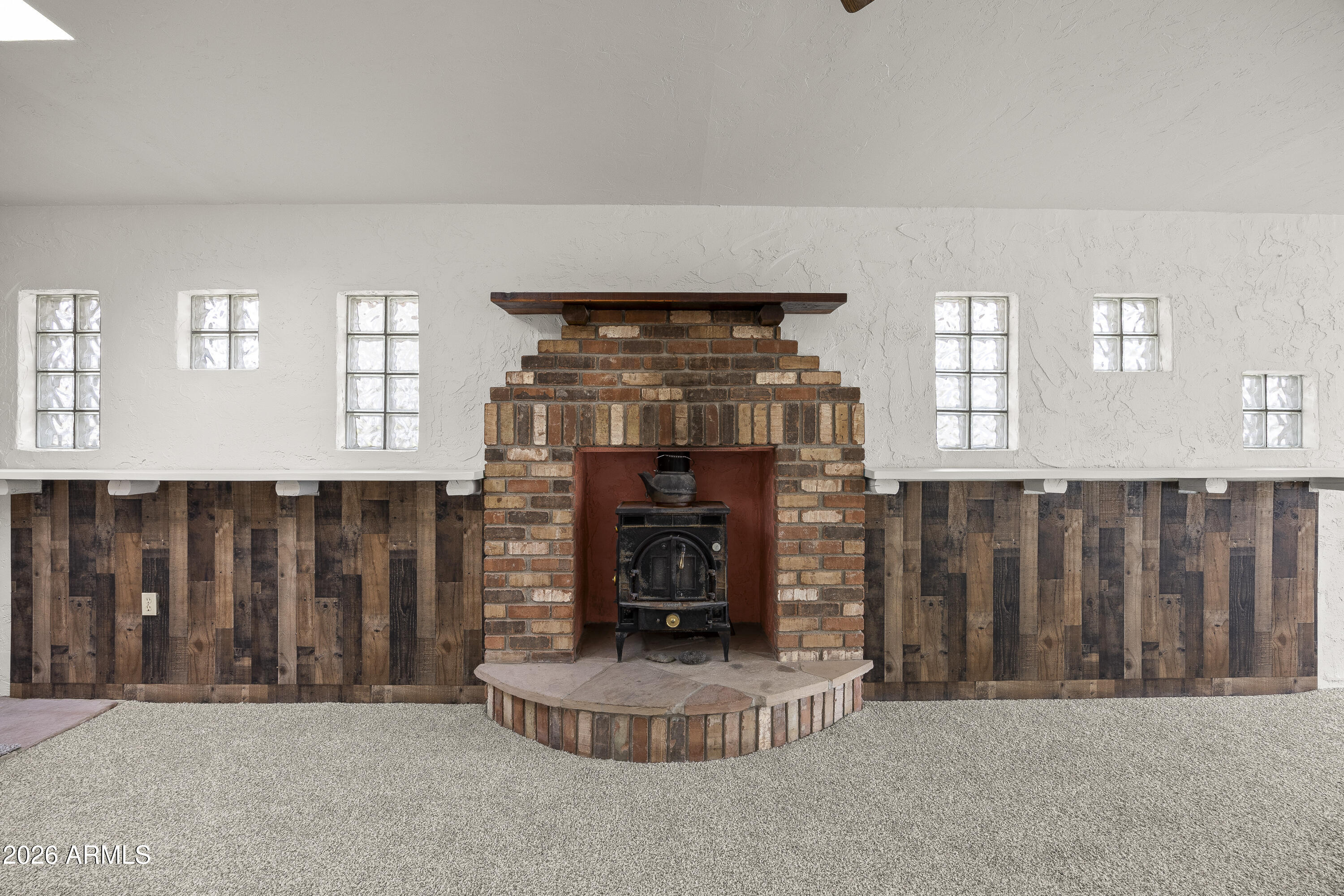 15940 North Goetz Place Tucson, AZ 85739 - Photo 9 of 37 a living room with fireplace