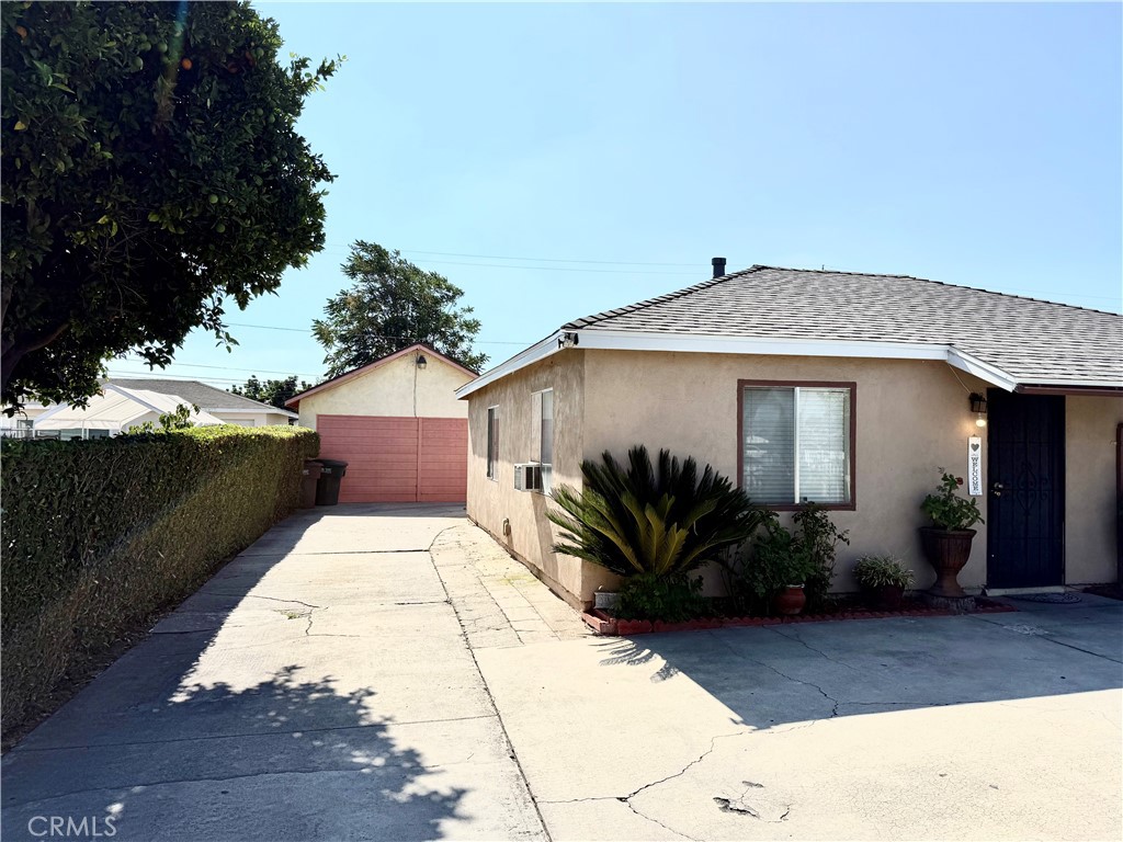 2306 Burkett Road El Monte, CA 91732 - Photo 4 of 8 a front view of a house with garden