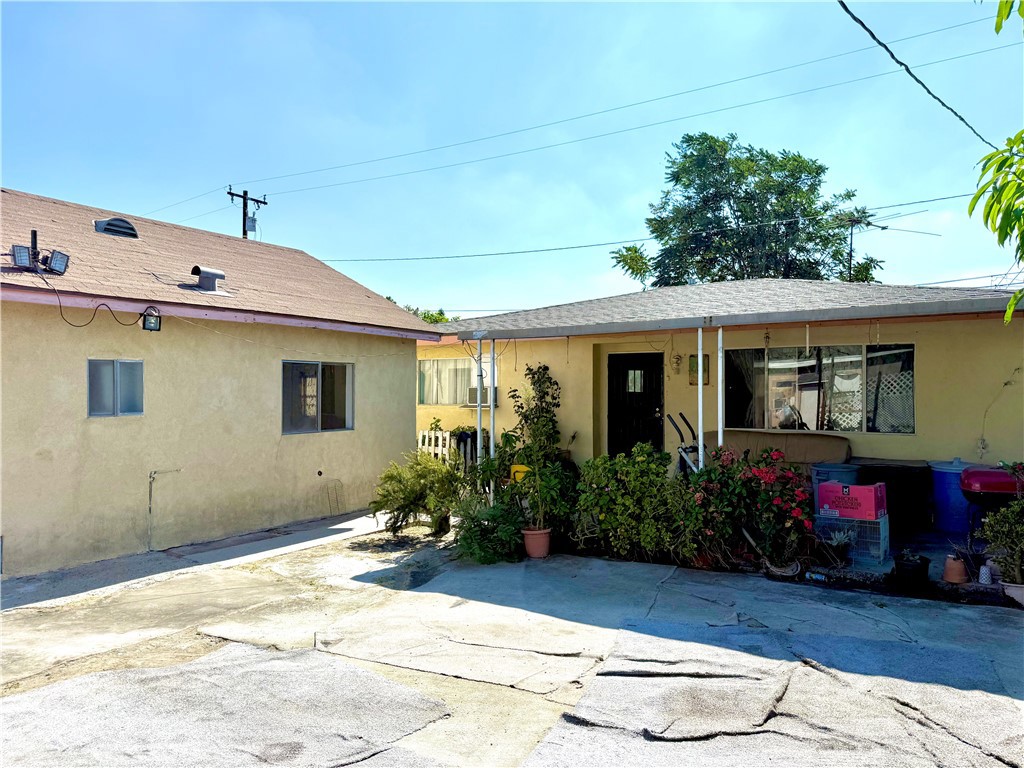 2306 Burkett Road El Monte, CA 91732 - Photo 6 of 8 a view of a house with sitting area and potted plants