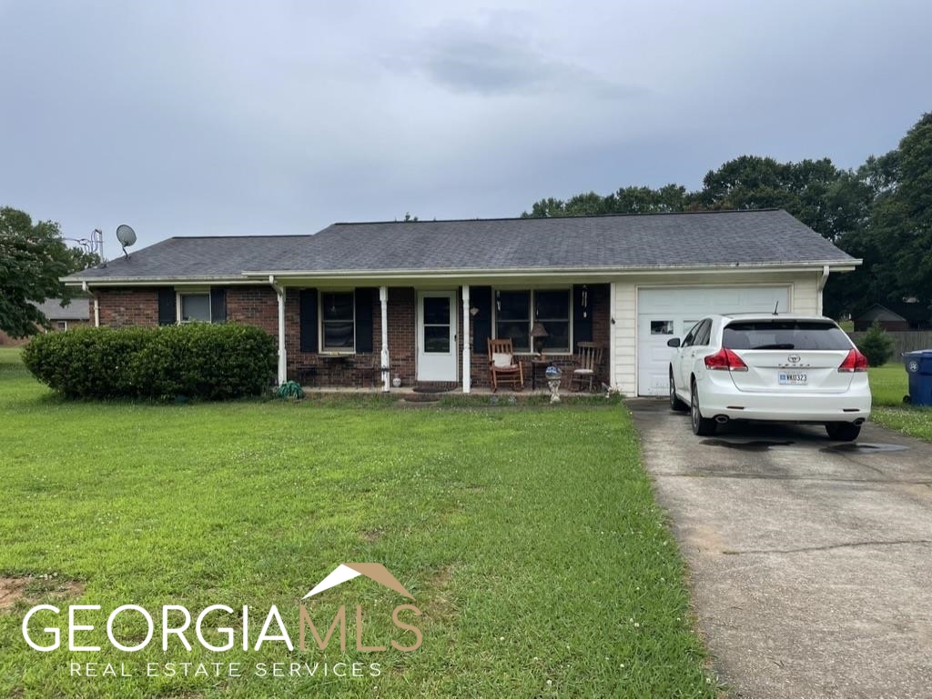 560 Miles Patrick Road Winder, GA 30680 - Photo 1 of 1 a front view of a house with garden