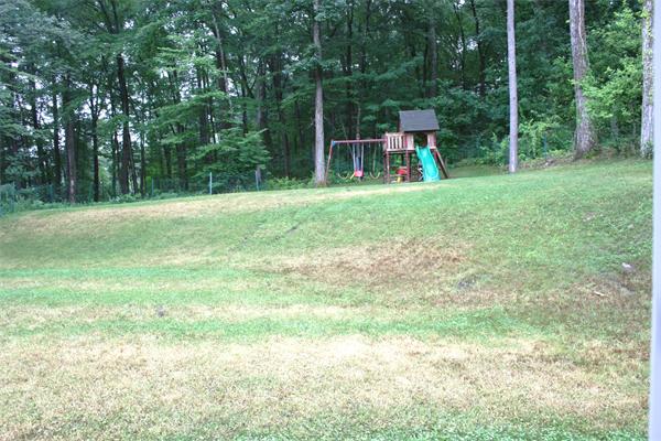 42 Indian Spring Road Ashland, MA 01721 - Photo 11 of 17 a view of a backyard with swimming pool