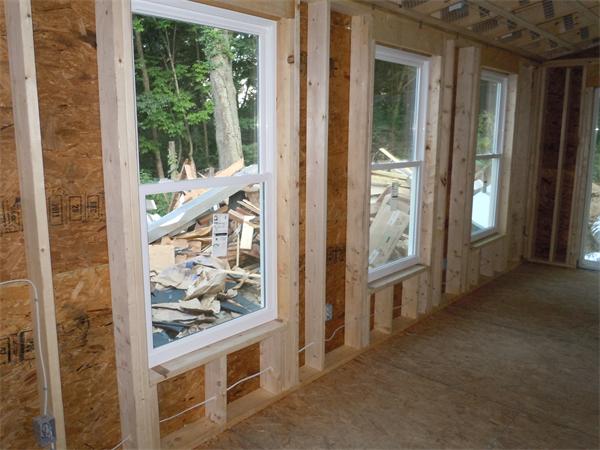 42 Indian Spring Road Ashland, MA 01721 - Photo 13 of 17 a view of a hallway with wooden floor and windows