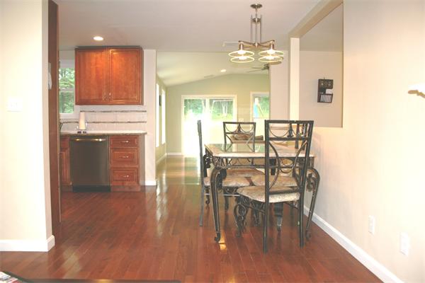 42 Indian Spring Road Ashland, MA 01721 - Photo 3 of 17 a view of a dining room with furniture and wooden floor