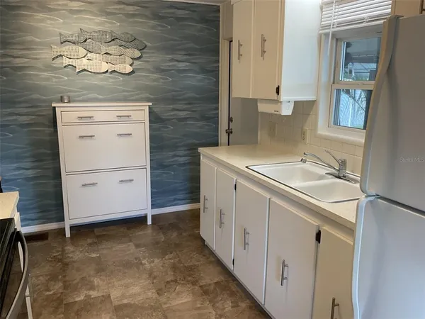 a bathroom with a sink a vanity and a mirror