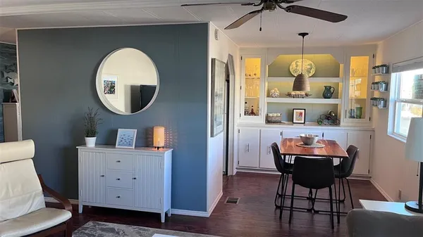 a room with furniture and wooden floor