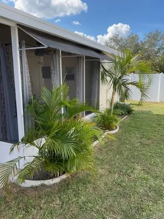 a view of a plant in front of a house