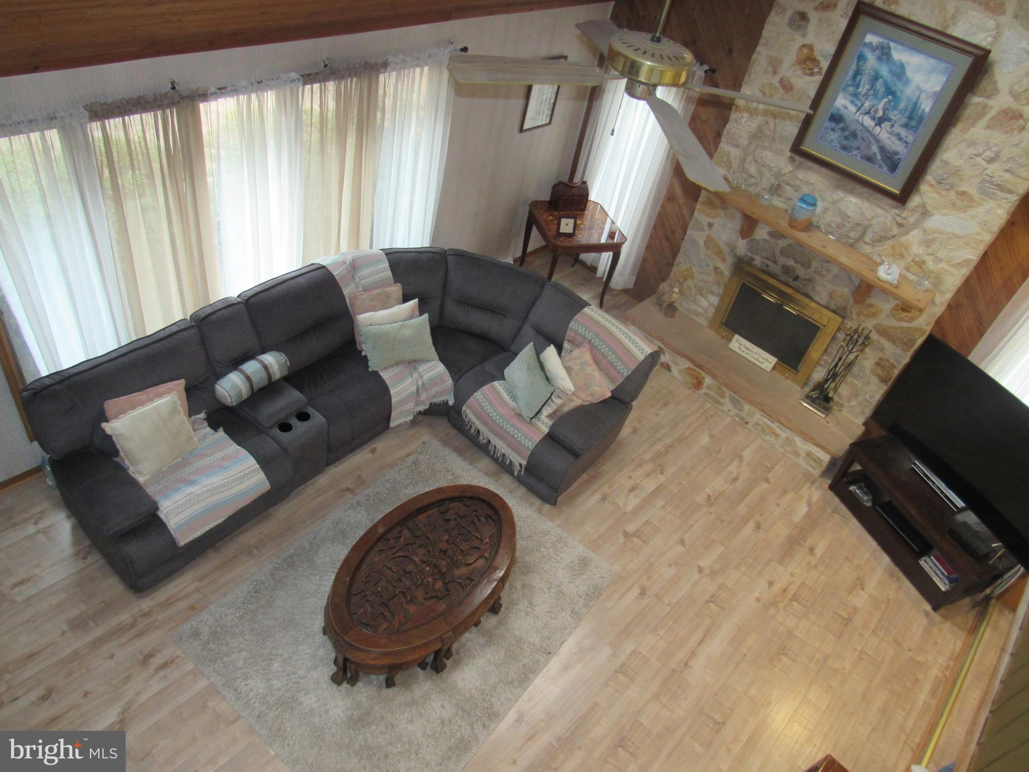 15 Cedar Grove Road Mullica Hill, NJ 08062 - Photo 16 of 41 a living room with furniture and a fireplace