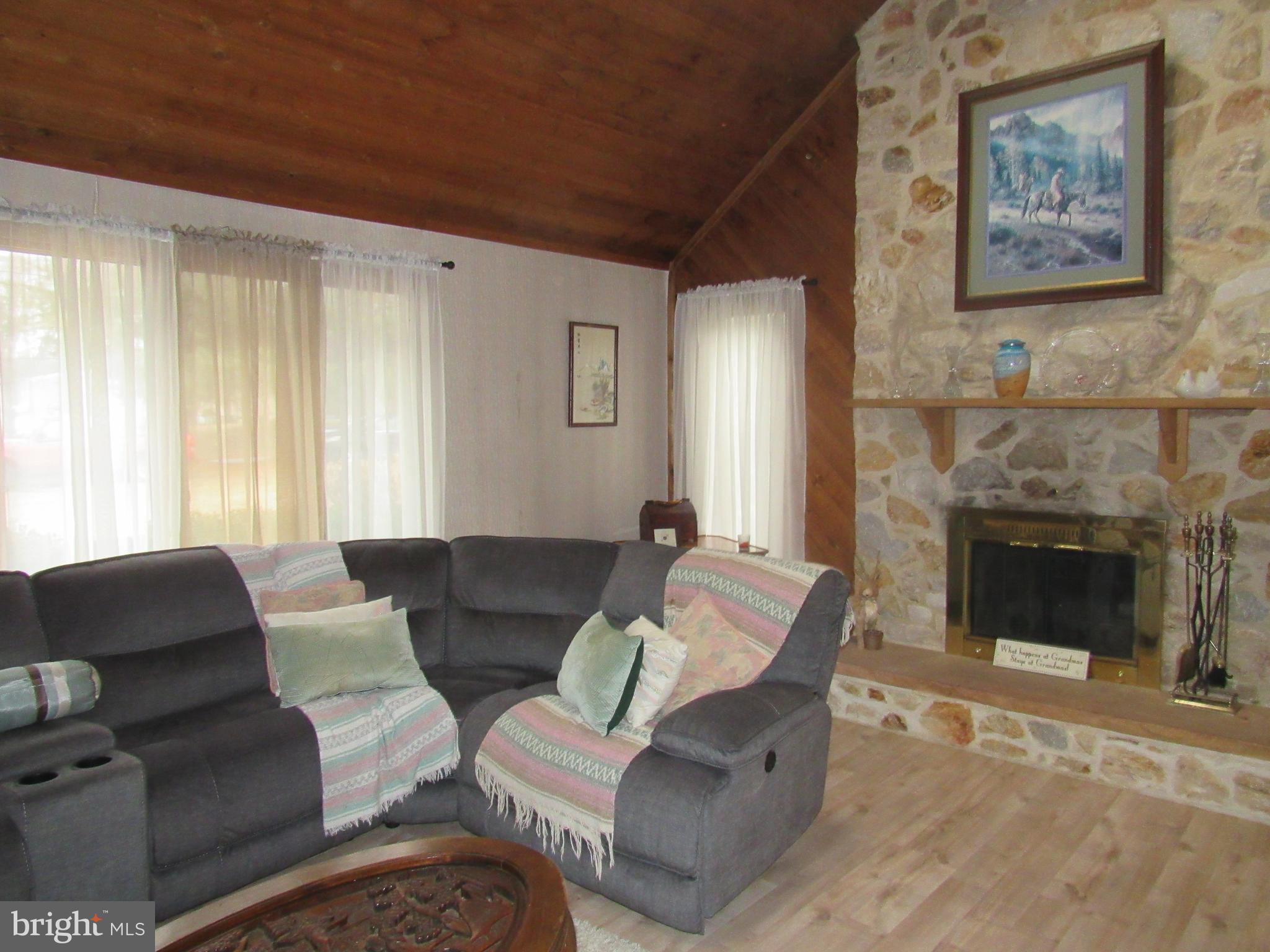 15 Cedar Grove Road Mullica Hill, NJ 08062 - Photo 19 of 41 a living room with furniture and a fireplace