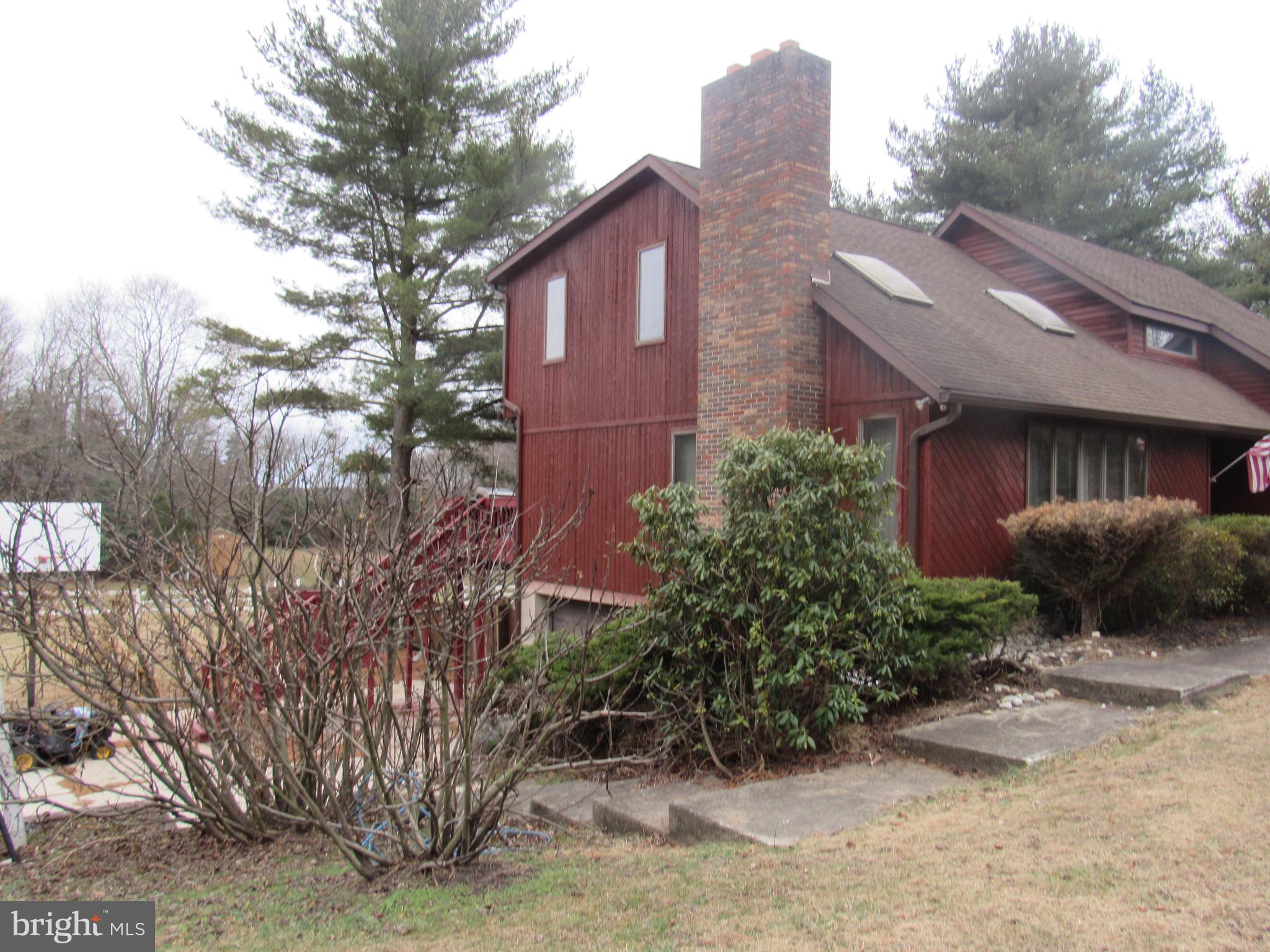 15 Cedar Grove Road Mullica Hill, NJ 08062 - Photo 2 of 41 a front view of a house with garden