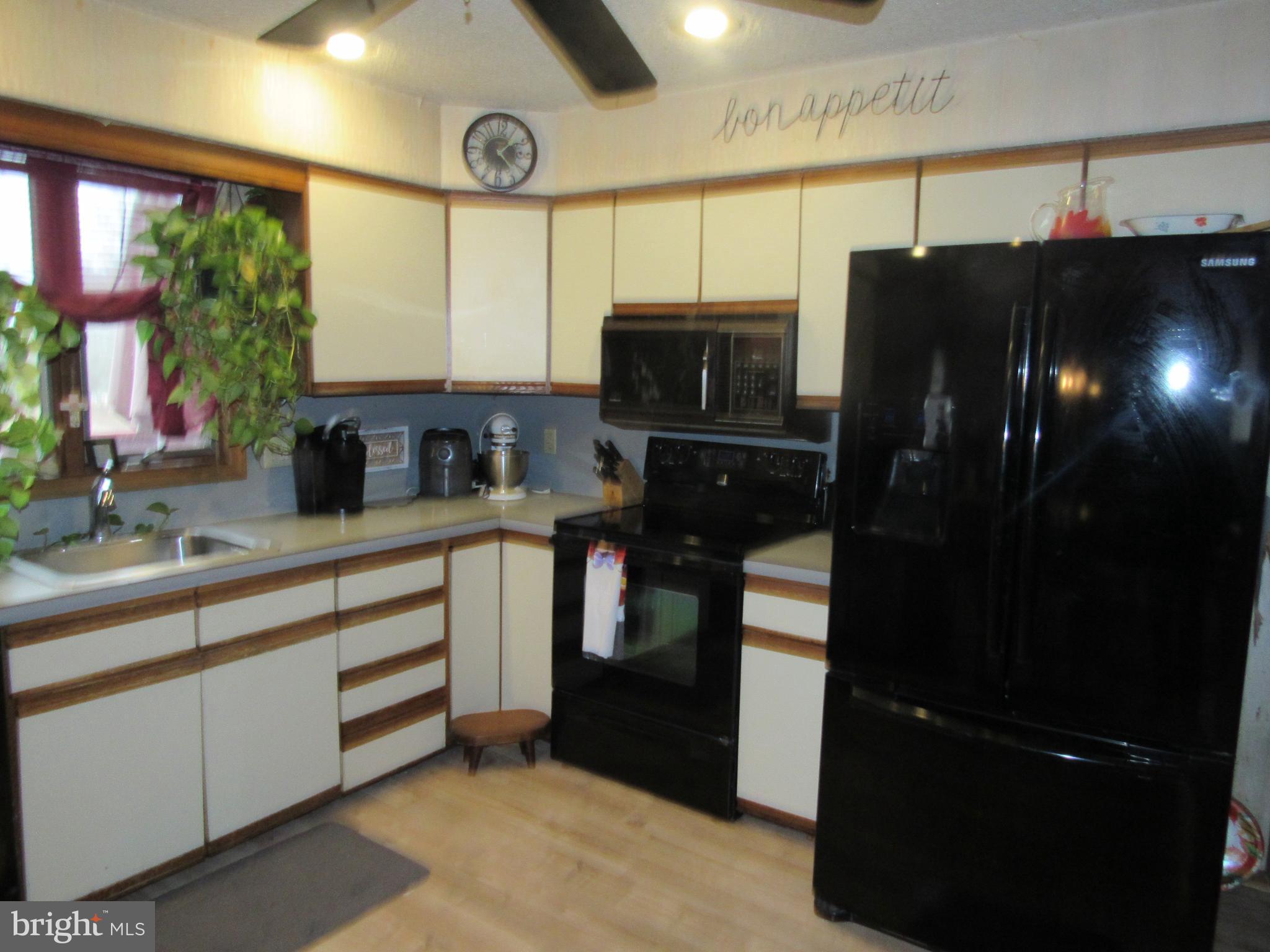 15 Cedar Grove Road Mullica Hill, NJ 08062 - Photo 23 of 41 a kitchen with a refrigerator and a sink