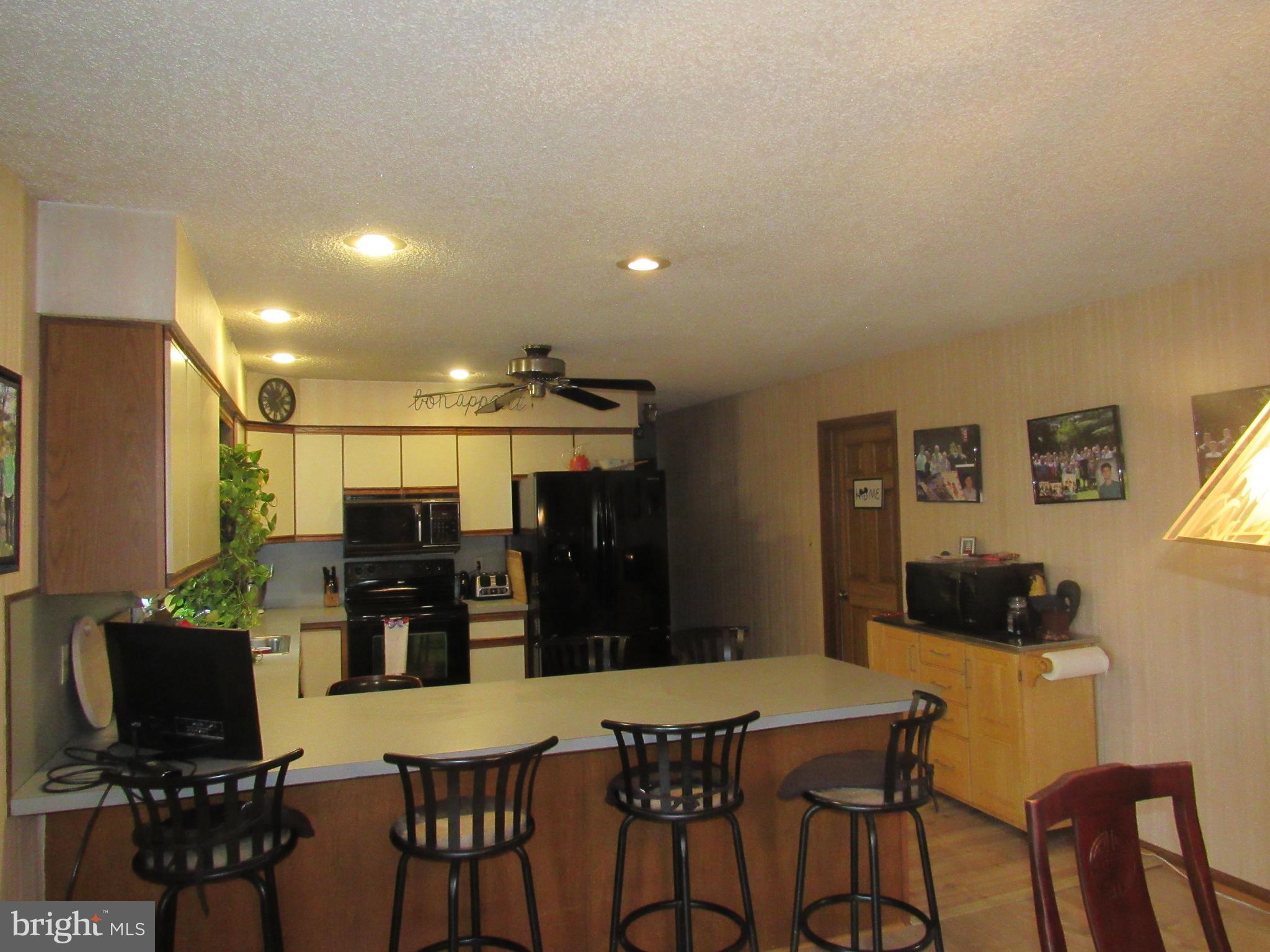15 Cedar Grove Road Mullica Hill, NJ 08062 - Photo 25 of 41 a kitchen with a table and chairs in it