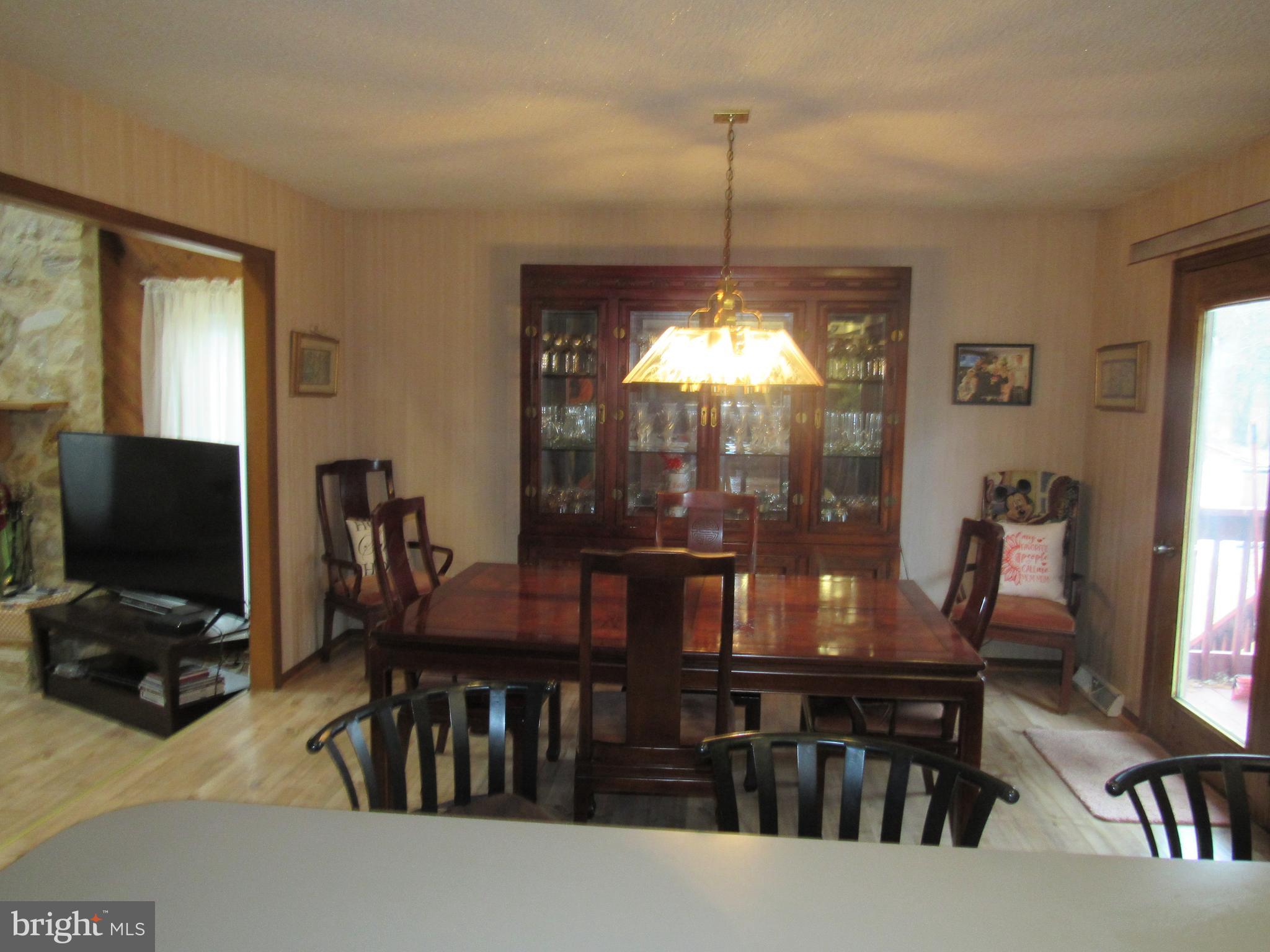 15 Cedar Grove Road Mullica Hill, NJ 08062 - Photo 26 of 41 a view of a dining room with furniture window and wooden floor