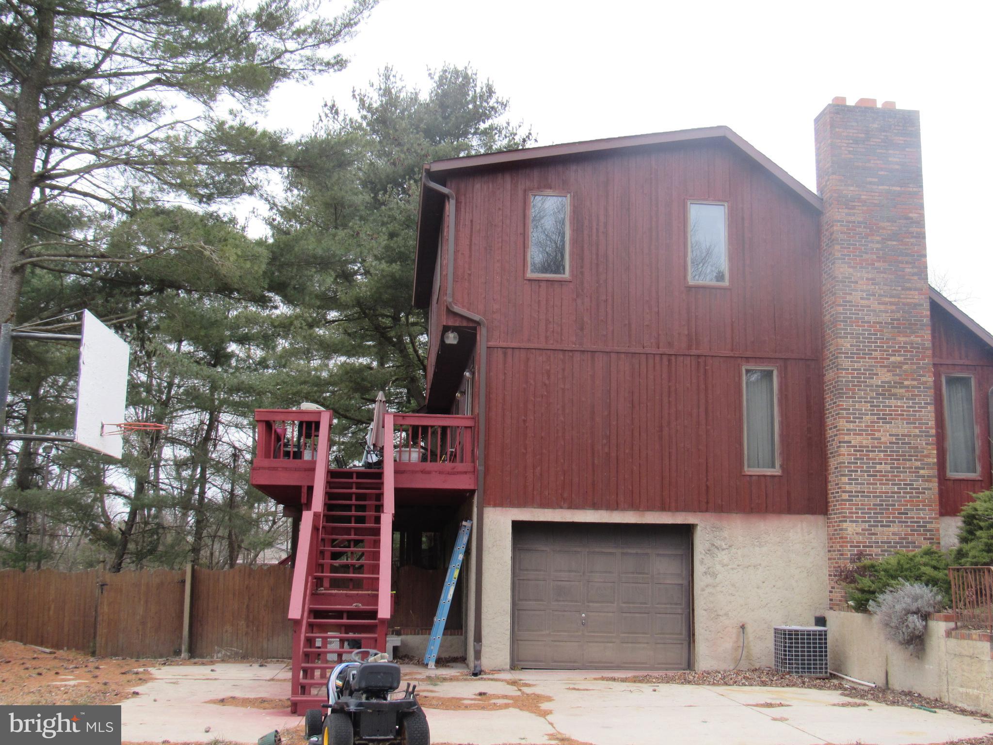 15 Cedar Grove Road Mullica Hill, NJ 08062 - Photo 38 of 41 a red brick house with a large windows