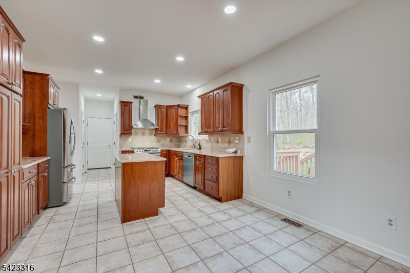 9 Stirrup Way Princeton, NJ 08540 - Photo 14 of 50 a kitchen with stainless steel appliances granite countertop a refrigerator and a sink