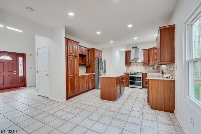 9 Stirrup Way Princeton, NJ 08540 - Photo 15 of 50 a kitchen with stainless steel appliances granite countertop a refrigerator and a stove top oven