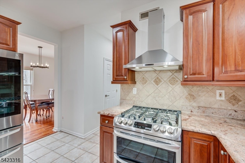 9 Stirrup Way Princeton, NJ 08540 - Photo 20 of 50 a stove top oven sitting inside of a kitchen