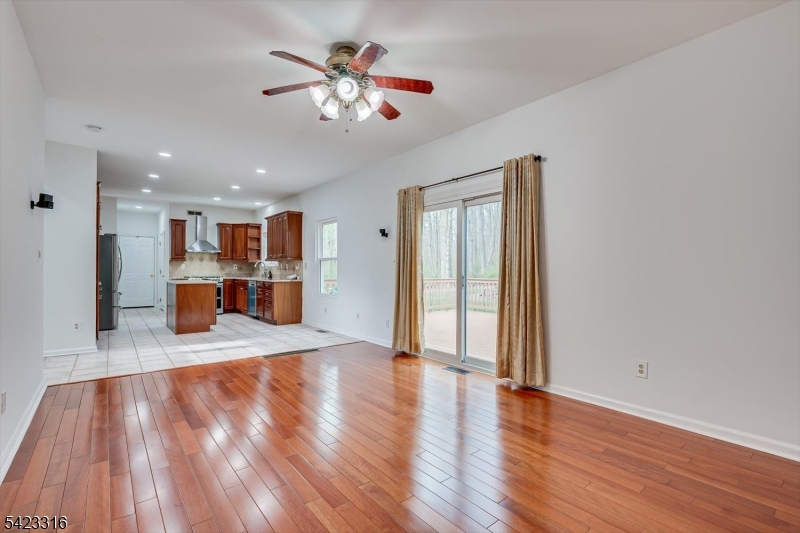 9 Stirrup Way Princeton, NJ 08540 - Photo 24 of 50 a view of a room with wooden floor and a kitchen