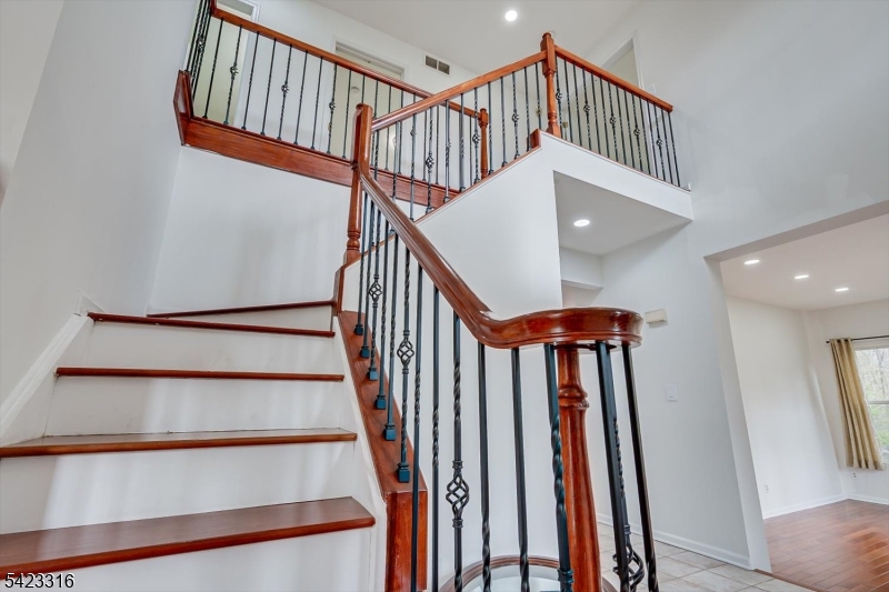 9 Stirrup Way Princeton, NJ 08540 - Photo 25 of 50 a view of entryway with wooden floor and a front door