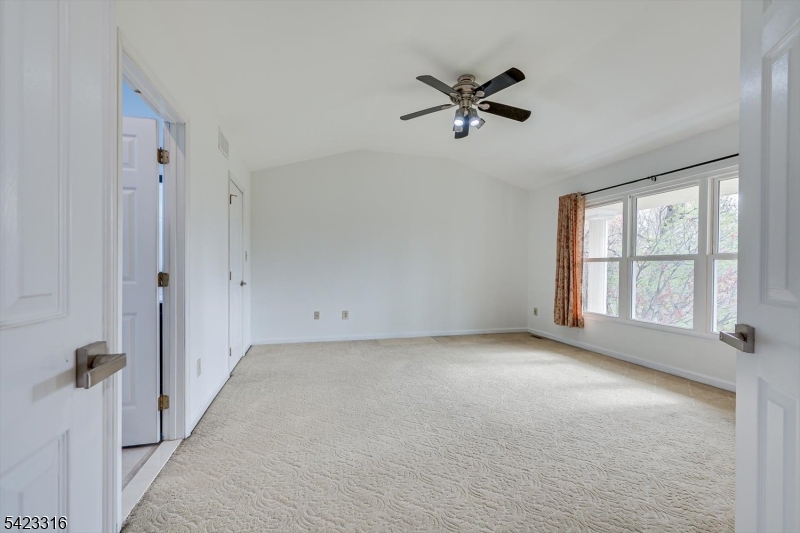 9 Stirrup Way Princeton, NJ 08540 - Photo 27 of 50 a view of a livingroom with a ceiling fan and window