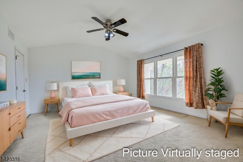 9 Stirrup Way Princeton, NJ 08540 - Photo 28 of 50 a spacious bedroom with a bed a couch and potted plant on the dresser