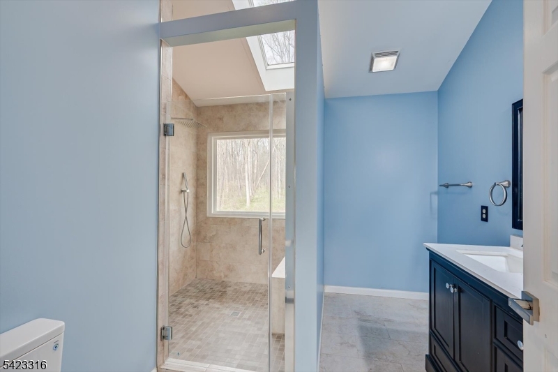 9 Stirrup Way Princeton, NJ 08540 - Photo 29 of 50 a bathroom with a sink and a mirror