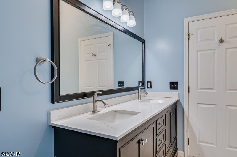 9 Stirrup Way Princeton, NJ 08540 - Photo 30 of 50 a bathroom with a sink and a mirror