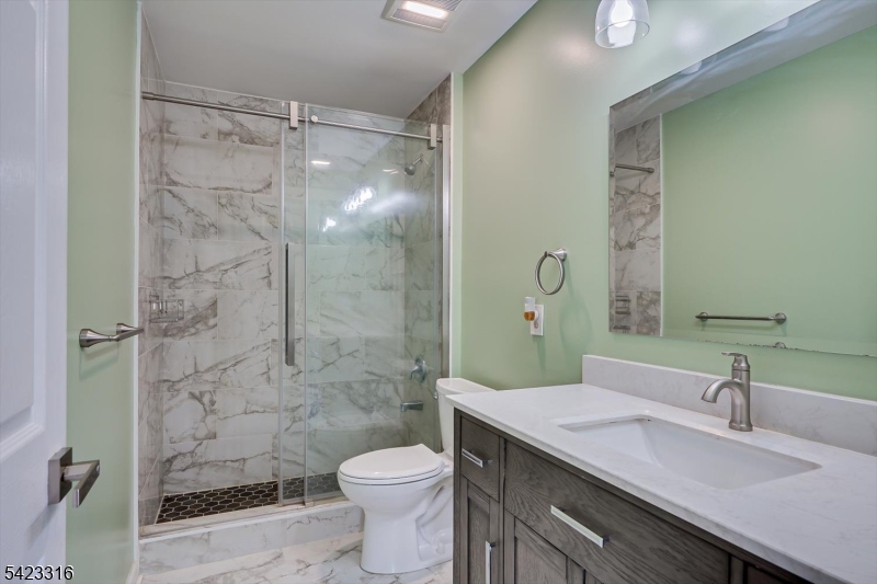 9 Stirrup Way Princeton, NJ 08540 - Photo 36 of 50 a bathroom with a sink a toilet and shower