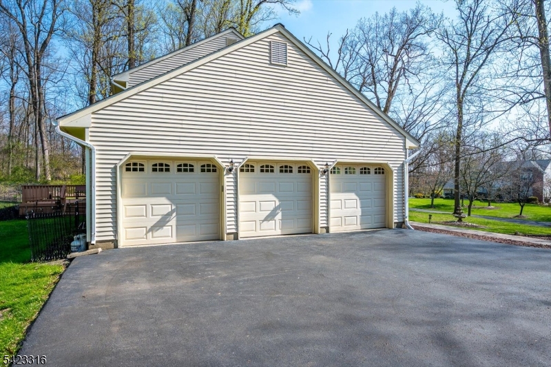 9 Stirrup Way Princeton, NJ 08540 - Photo 41 of 50 a front view of a house with a garden and trees