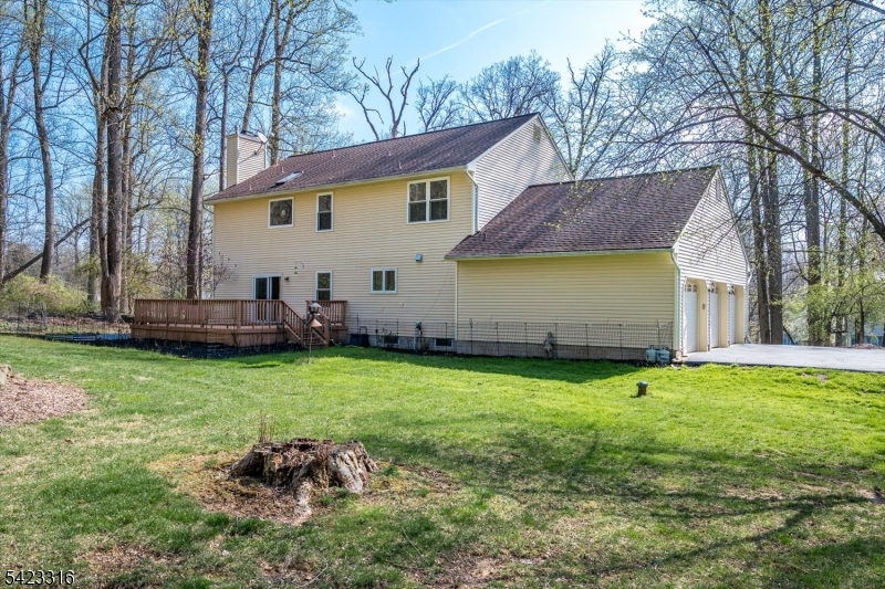 9 Stirrup Way Princeton, NJ 08540 - Photo 42 of 50 a backyard of a house with table and chairs