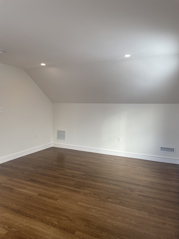 29 Crescent Road, Unit 29 Belmont, MA 02478 - Photo 18 of 21 an empty room with wooden floor and windows