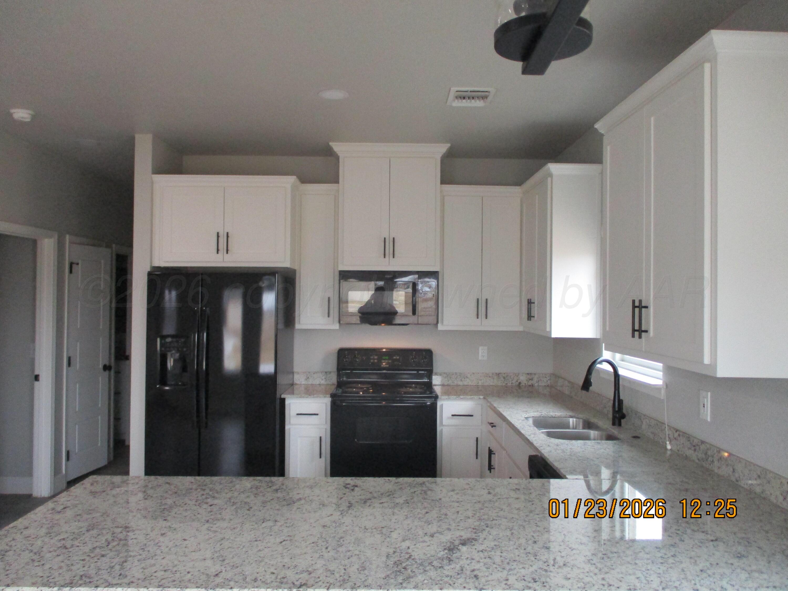 8707 Clinton Glenn Road, Unit 6 Amarillo, TX 79119 - Photo 5 of 12 Kitchen