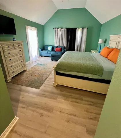 a bedroom with a bed and furniture