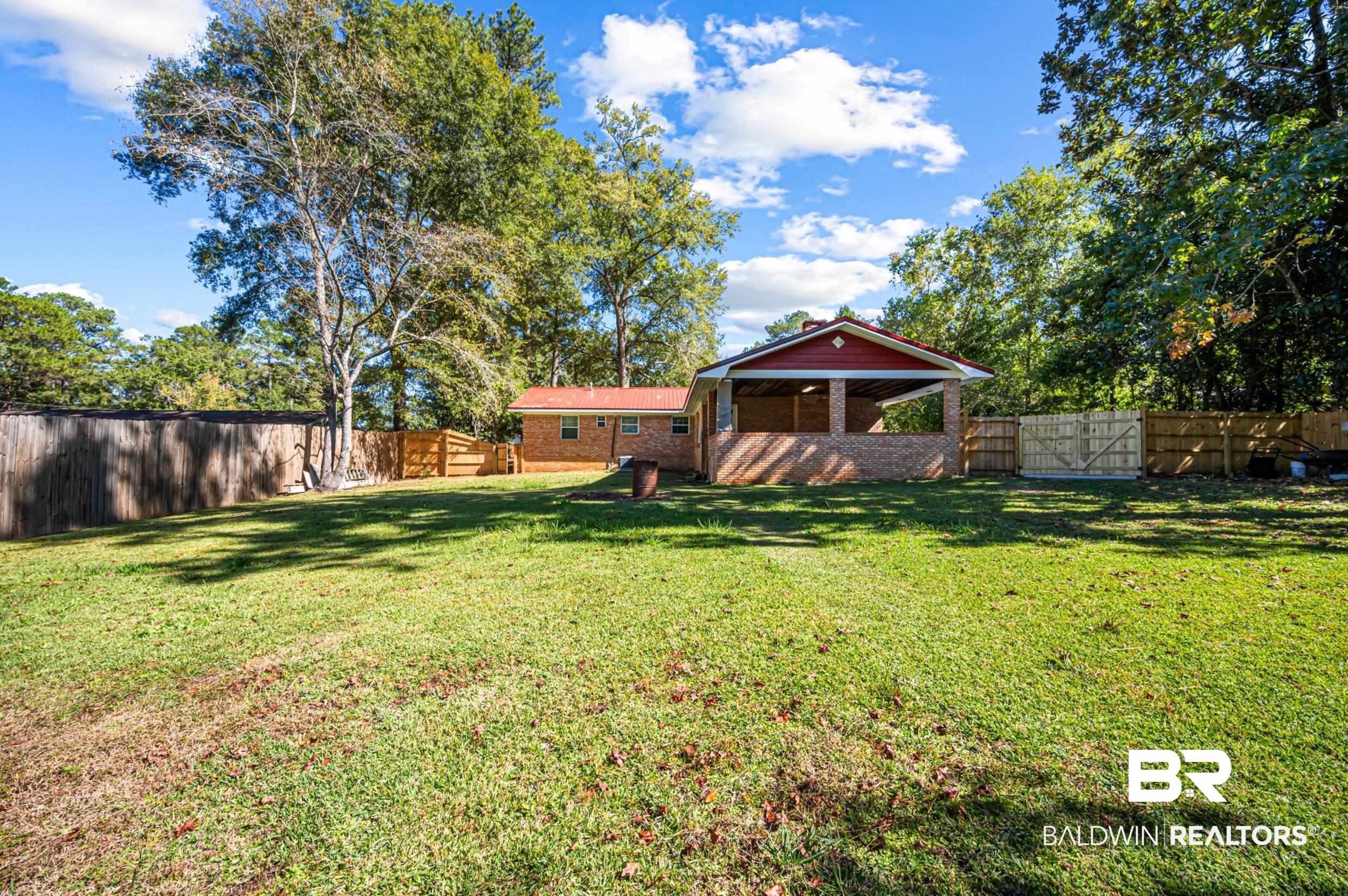 1605 Collier Avenue Bay Minette, AL 36507 - Photo 35 of 36 Fenced backyard featuring a gate