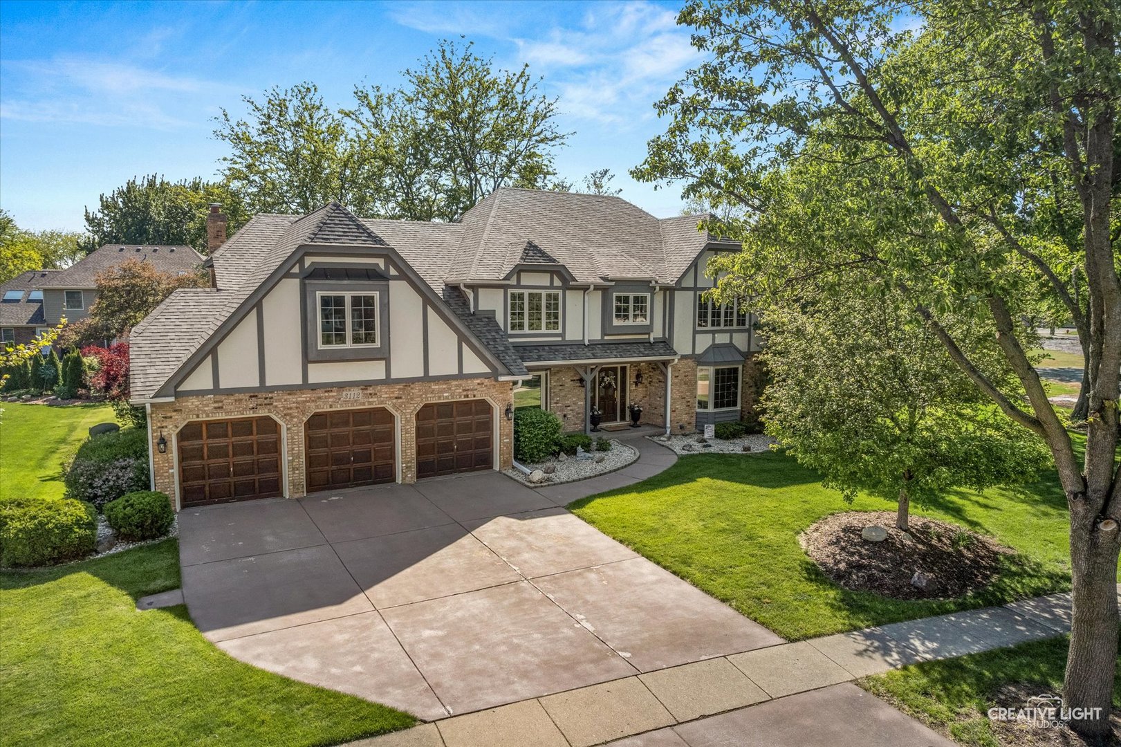 3112 Turnberry Road St. Charles, IL 60174 - Photo 1 of 43 a front view of a house with a garden and plants