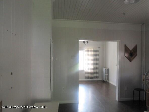 820 Scott Road Dickson City, PA 18519 - Photo 22 of 30 a view of empty room with wooden floor and fan