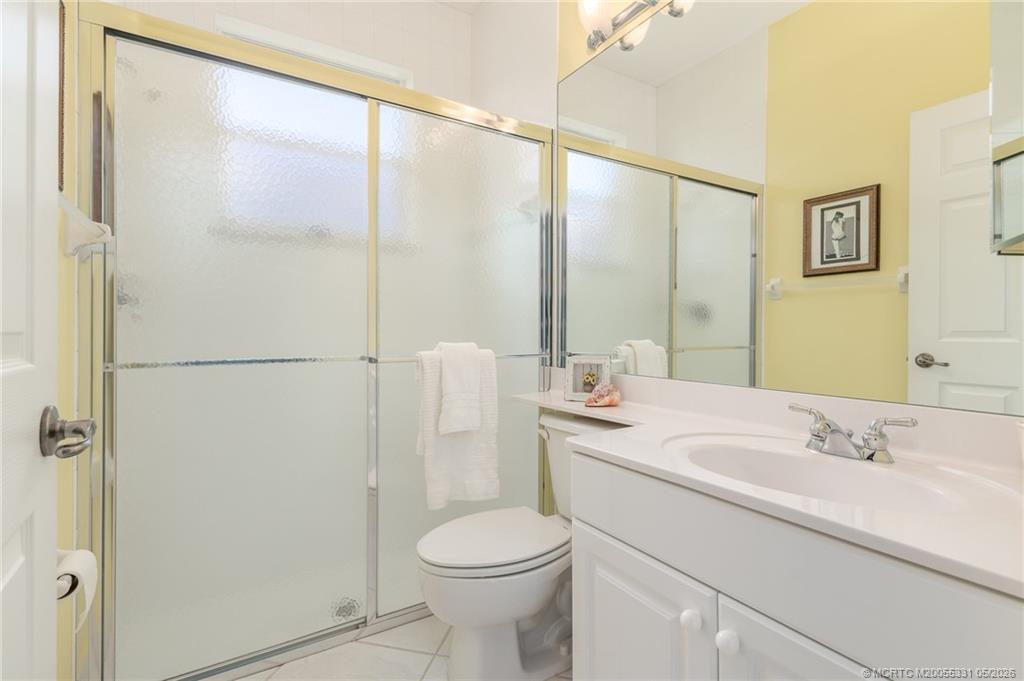 2216 Southeast Stonehaven Road Port St. Lucie, FL 34952 - Photo 22 of 67 a bathroom with a sink toilet and shower
