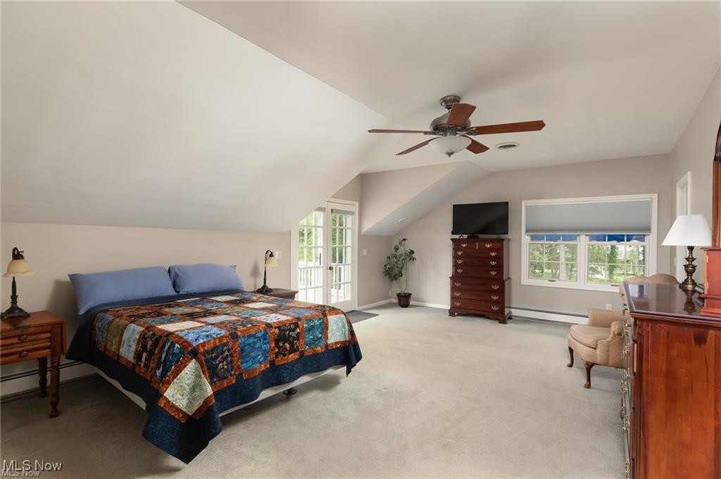 644 Riverside Drive Painesville, OH 44077 - Photo 22 of 48 Bedroom featuring vaulted ceiling, baseboards, light colored carpet, a ceiling fan, and a baseboard radiator