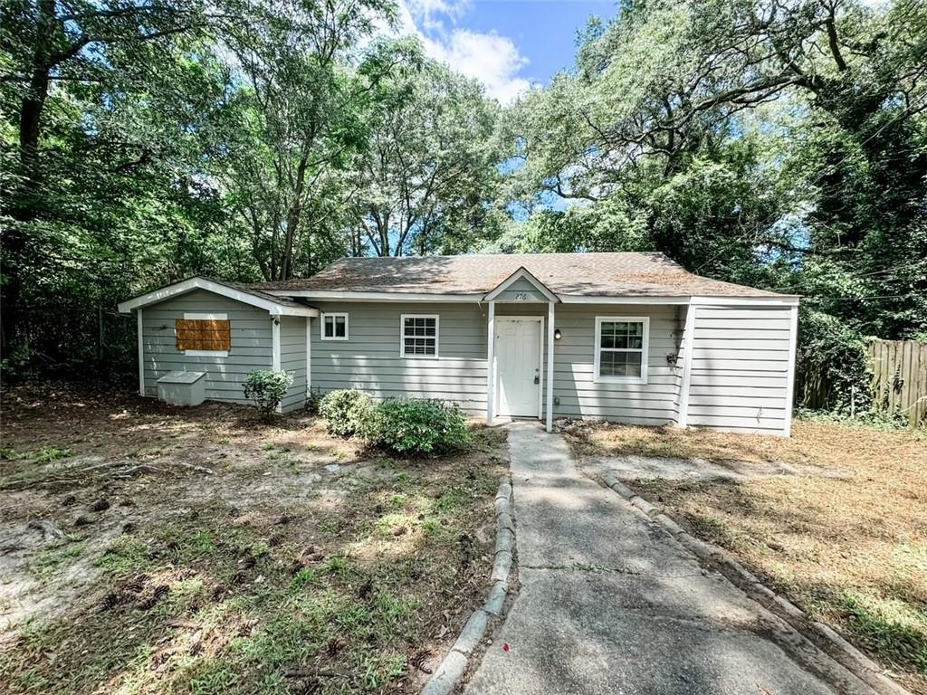 276 Fairburn Road Northwest Atlanta, GA 30331 - Photo 1 of 1 a view of a house with a yard