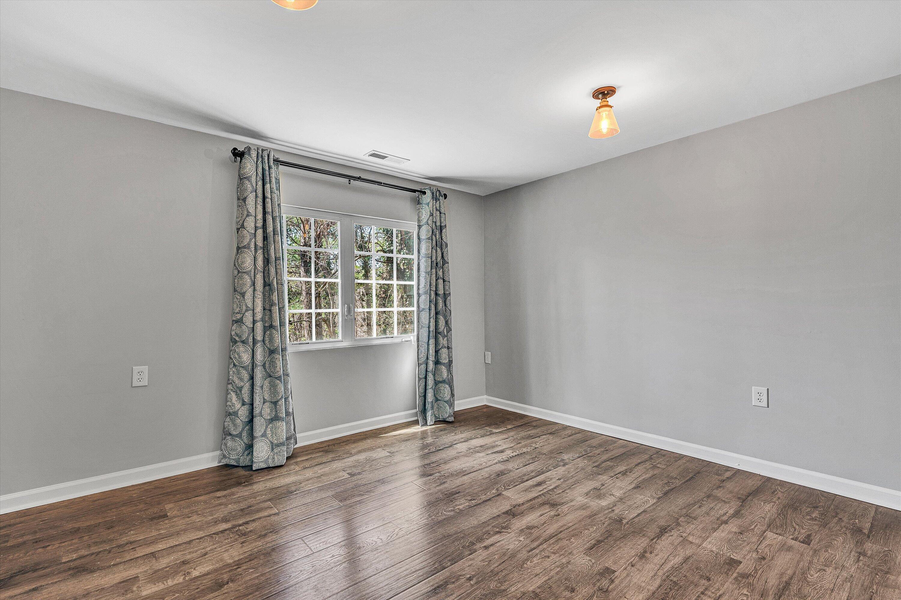 3259 Rasmont Road Roanoke, VA 24018 - Photo 28 of 36 an empty room with wooden floor and windows