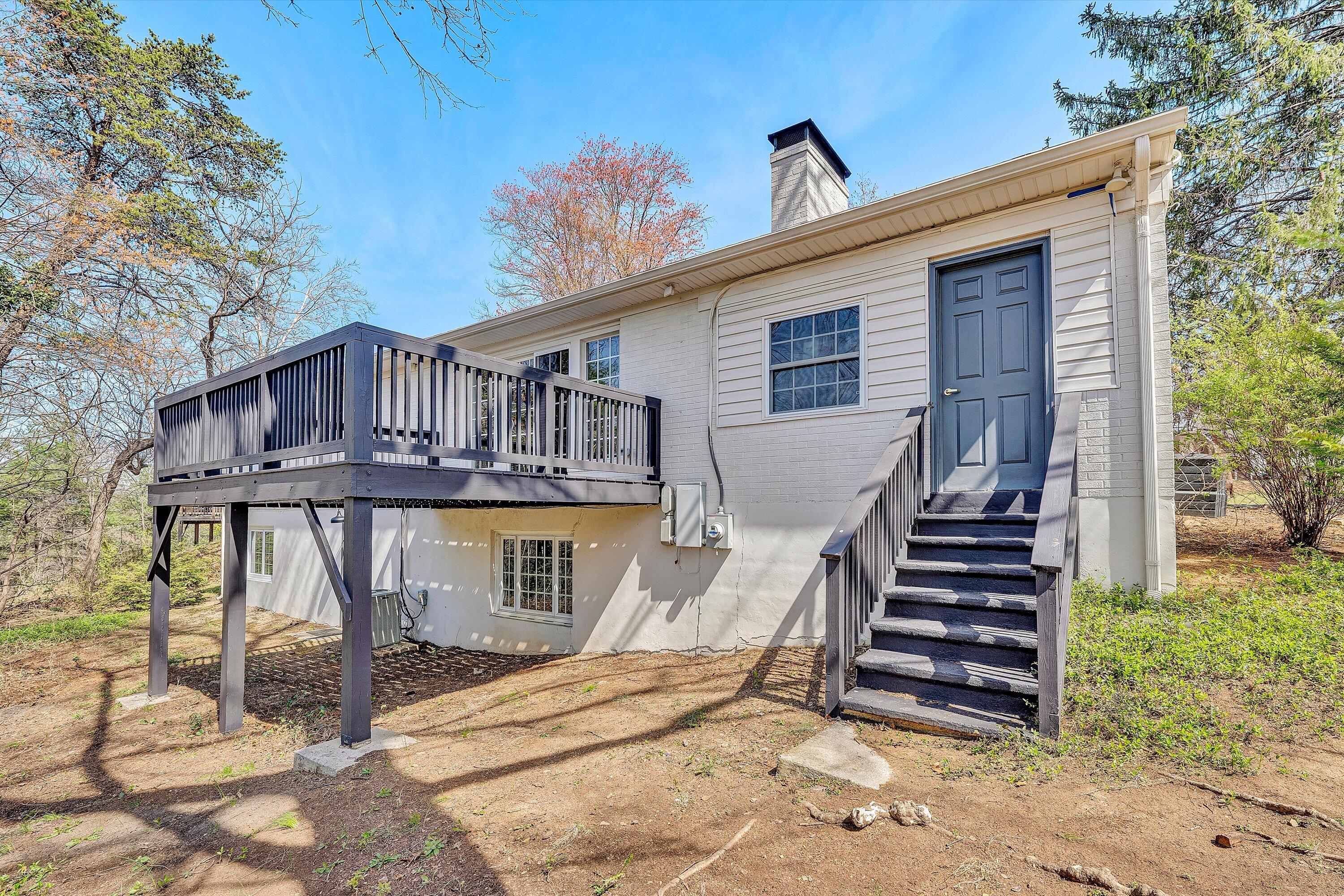3259 Rasmont Road Roanoke, VA 24018 - Photo 31 of 36 a view of a house with wooden stairs and a large tree