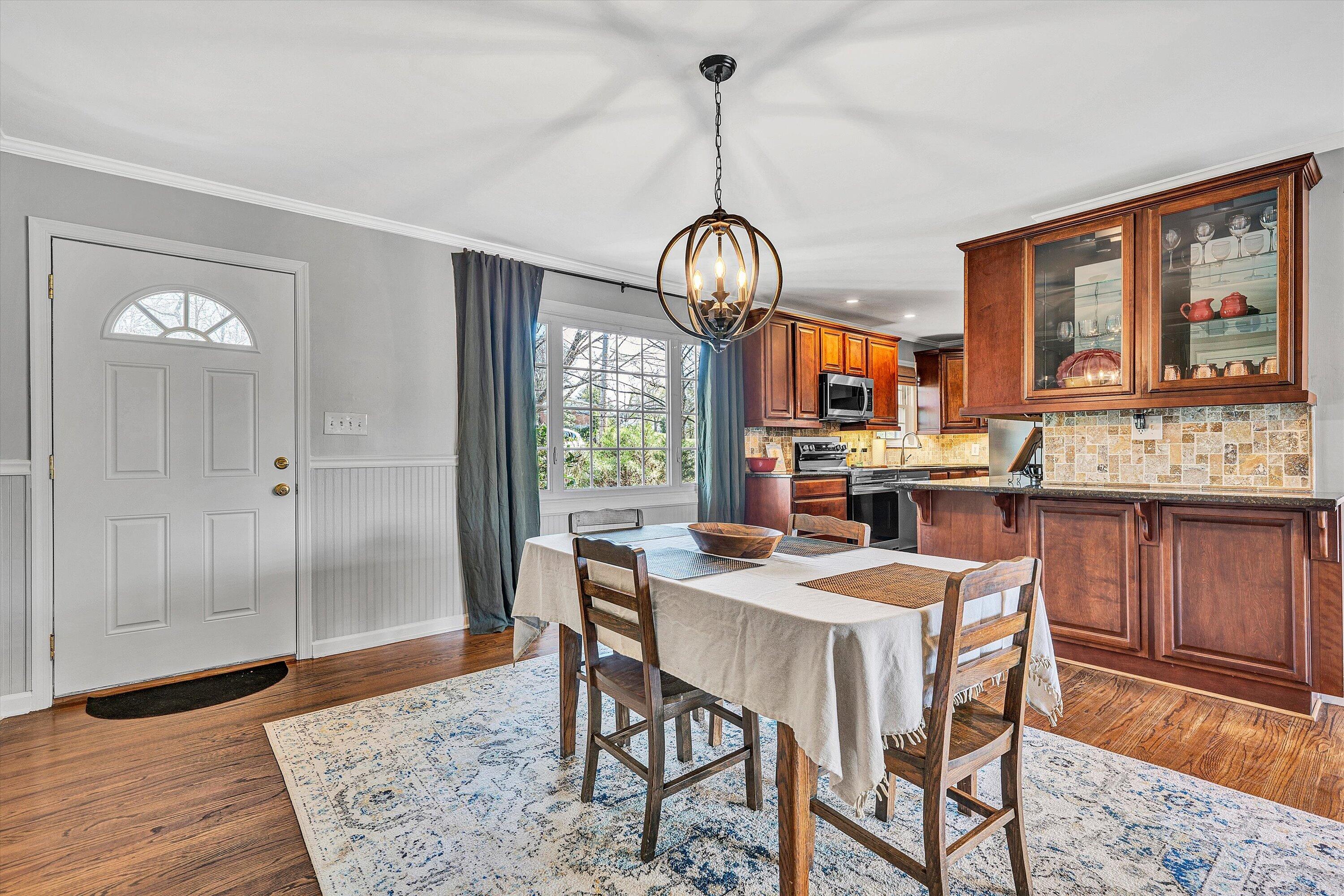 3259 Rasmont Road Roanoke, VA 24018 - Photo 5 of 36 a view of a dining room with furniture window and wooden floor