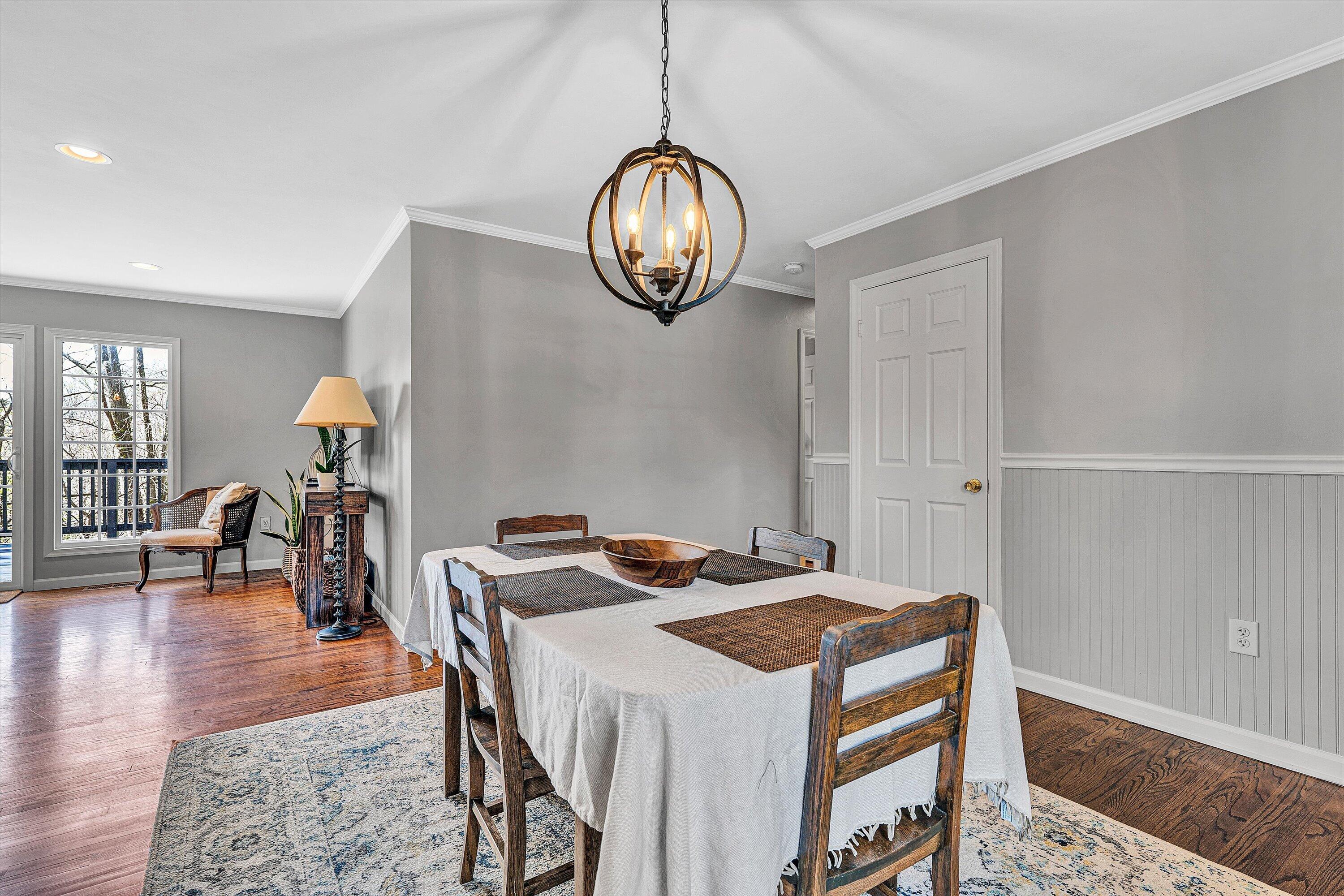 3259 Rasmont Road Roanoke, VA 24018 - Photo 6 of 36 a dining room with table chairs and wooden floor