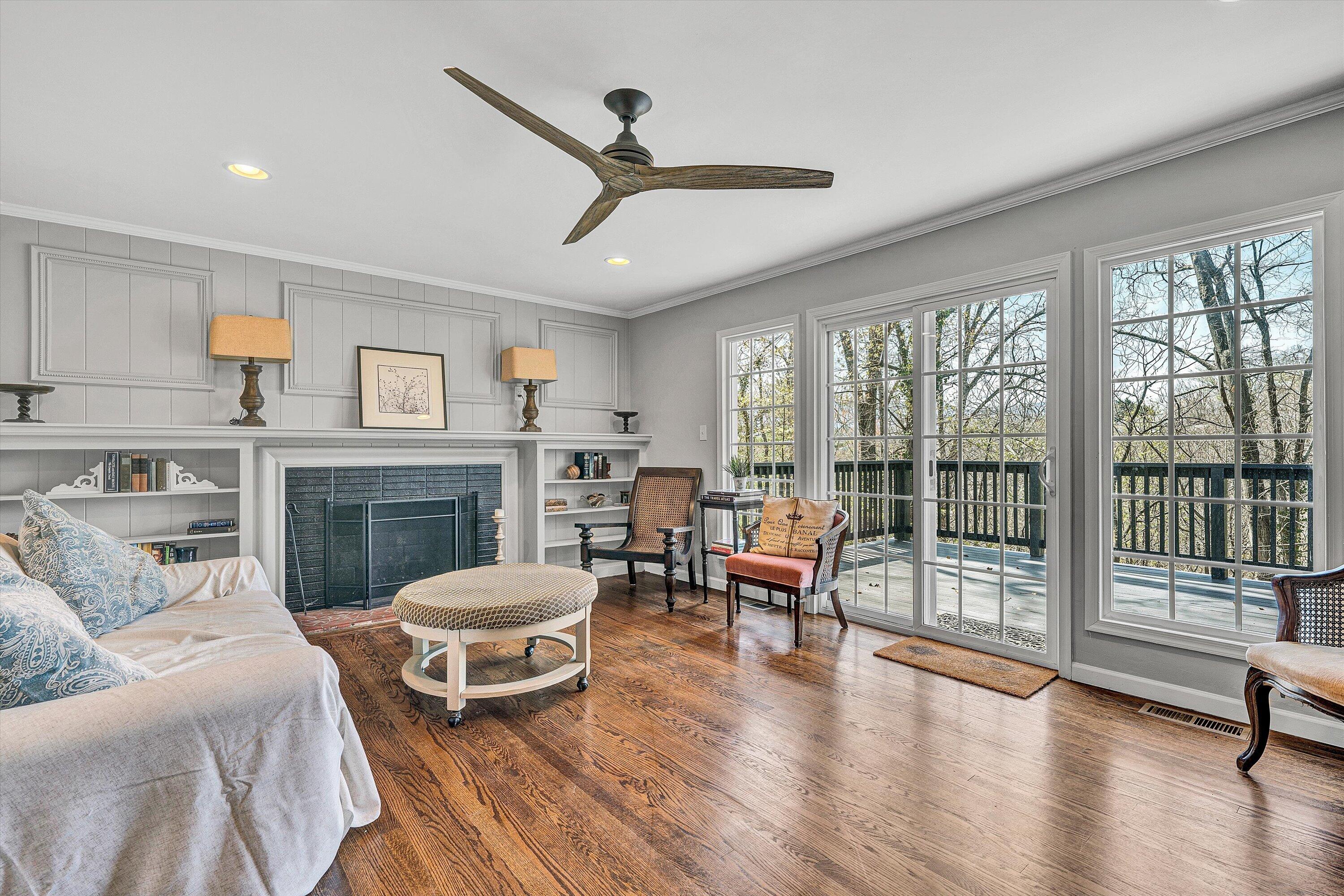 3259 Rasmont Road Roanoke, VA 24018 - Photo 10 of 36 a living room with furniture a fireplace and a floor to ceiling window