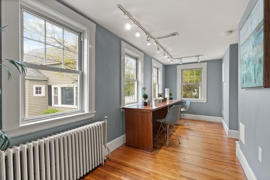 151 Forest Street Malden, MA 02148 - Photo 14 of 33 a view of a large room with wooden floor and windows