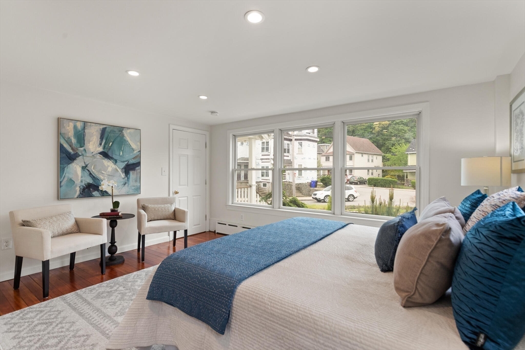 151 Forest Street Malden, MA 02148 - Photo 15 of 33 a spacious bedroom with a large bed and a large window