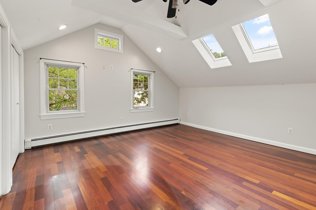 151 Forest Street Malden, MA 02148 - Photo 17 of 33 an empty room with wooden floor and windows