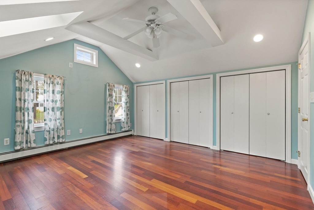 151 Forest Street Malden, MA 02148 - Photo 20 of 33 a view of an empty room with window and wooden floor