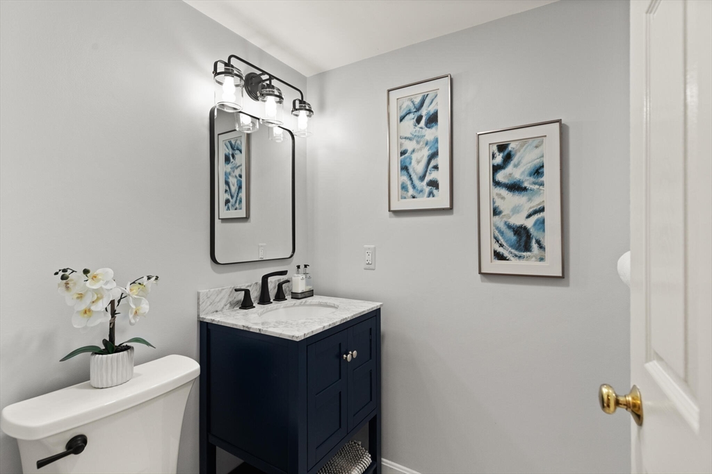 151 Forest Street Malden, MA 02148 - Photo 23 of 33 a bathroom with a sink and a mirror