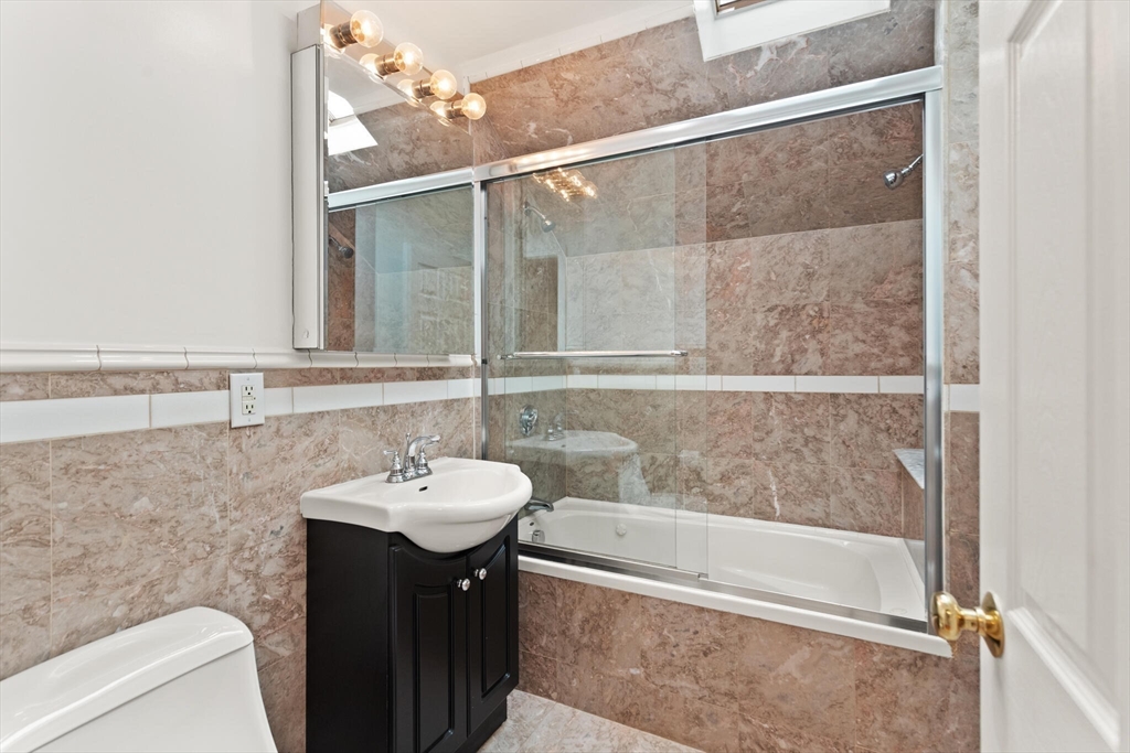 151 Forest Street Malden, MA 02148 - Photo 24 of 33 a bathroom with a sink and a mirror