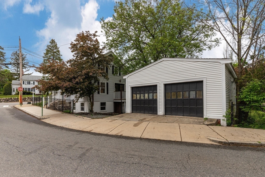 151 Forest Street Malden, MA 02148 - Photo 27 of 33 a view of a house with a yard and garage